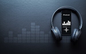 Phone with the words Podcast and headphones_300x190