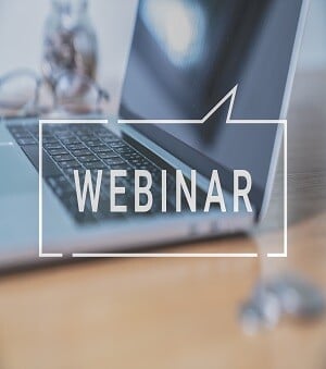 Word "webinar"  and image of laptop in the background