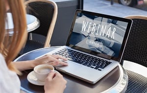 Woman sitting in front of a laptop with the words 