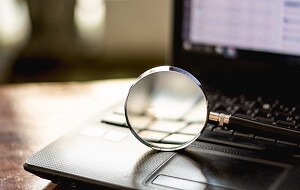 Magnifying glass on computer laptop